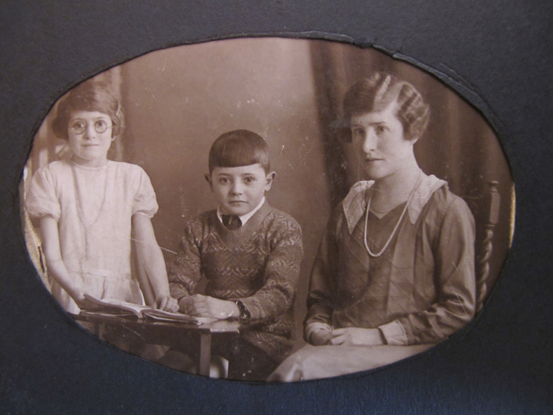 In the photograph, we see Frank pictured with his sister and their mother, Alice, in the late 1920s. Edwin had mysteriously left his young family by the time this photo was taken in the 1920s, hence, Alice and the children are pictured without him.