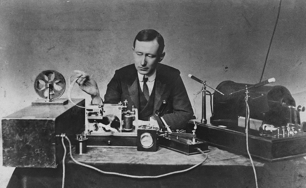 Marconi pictured demonstrating the apparatus he used in his first long distance radio transmissions in the 1890s.