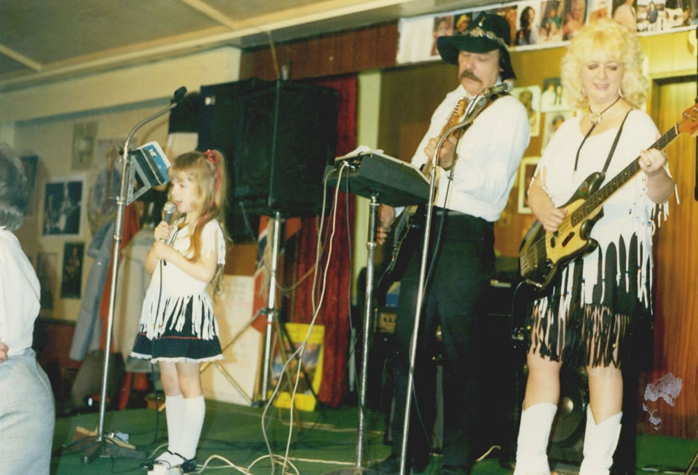 Sheridan performing with her parents as a child