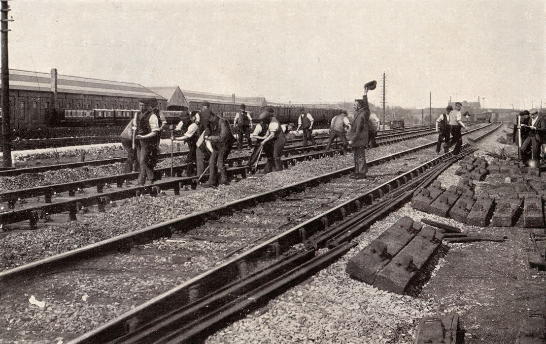 Railway workers re-laying the lines