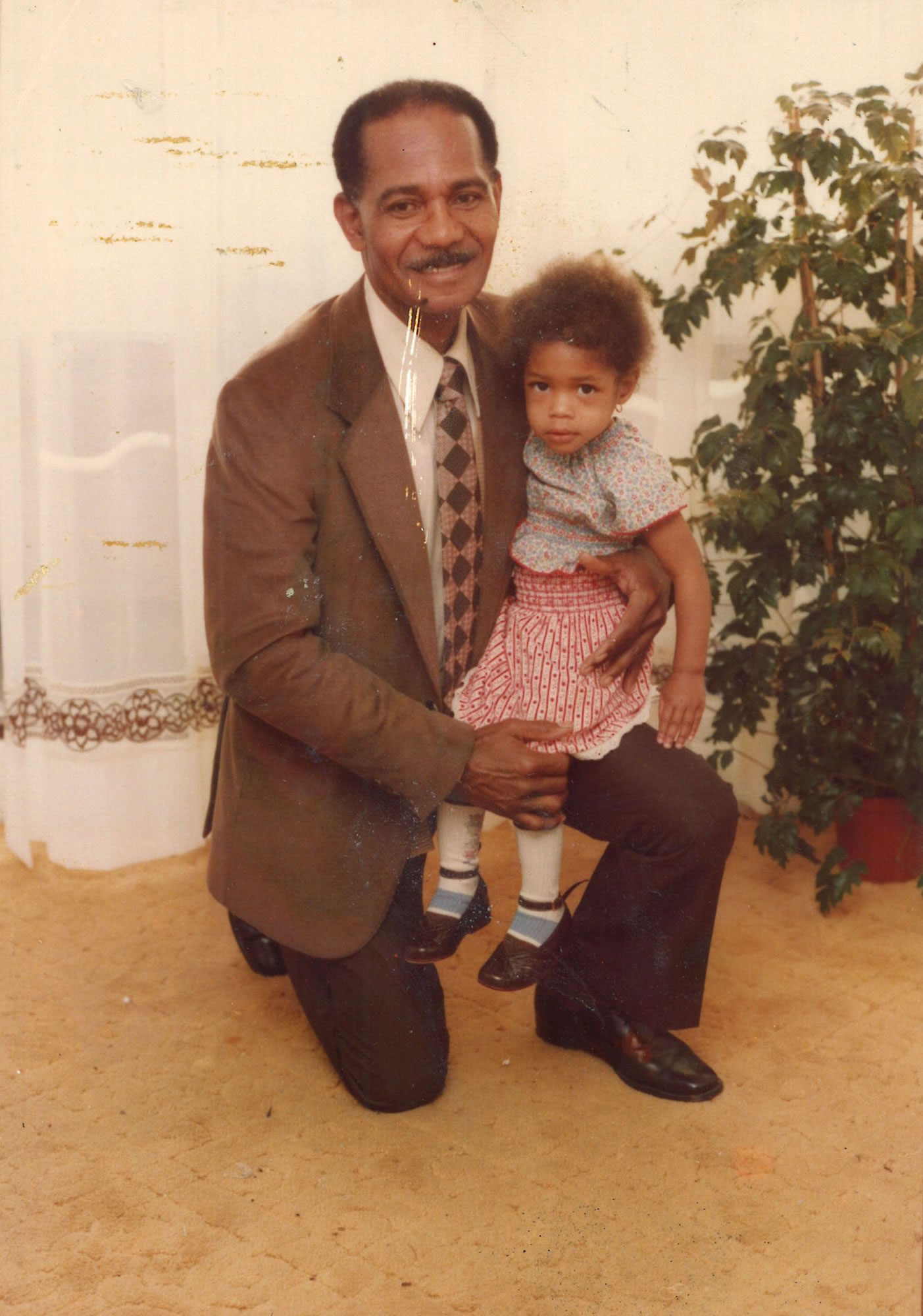 Joscelyn Harris (Naomie's maternal grandfather) and Naomie Harris (aged 4) - taken in Jamaica, 1980 - Image credit: BBC/Wall to Wall/Newton Maxwell Harris