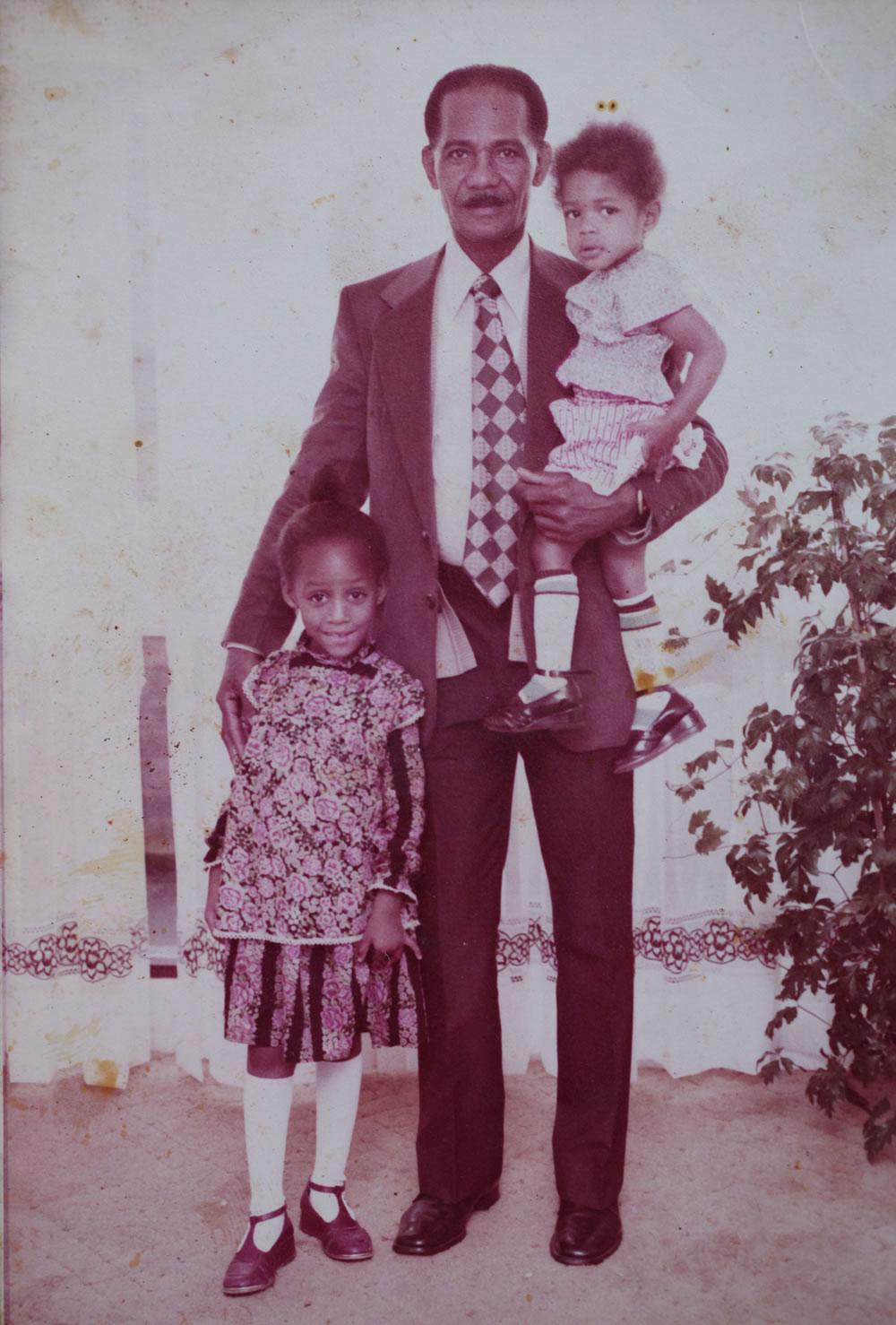 (L-R) Chenelle (Naomie's cousin), Joscelyn Harris (Naomie's maternal grandfather) and Naomie Harris (aged 4) - taken in Jamaica, 1980 - Image Credit: BBC/Wall to Wall/Jasmine Harris