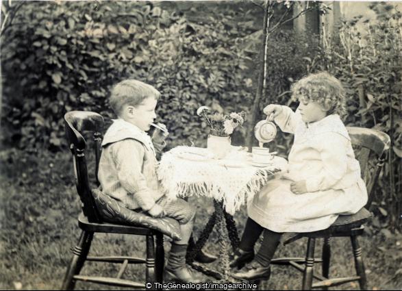 Boy and Girl having tea and biscuits in garden (boy, C1900, Garden, girl, Tea Party)