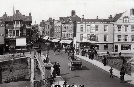 Bridge and Fore Street Bridgwater 1908 (1908, bicycle, Bridge, Bridge Street, Butcher Shop, England, Fore Street, horse and cart, Photography Studio, shop, Somerset, The Punch Bowl Inn)