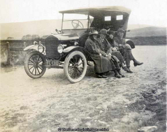 Family sitting on a running Board (Car, family, Ford, Model T)
