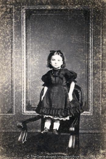 Girl standing on seat Jersey Photographer J Daly (chair, Girl, standing)
